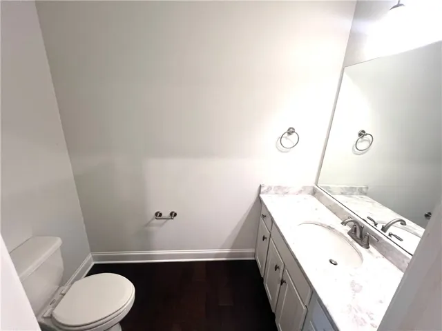 This bathroom features a contemporary vanity with a spacious countertop and sleek fixtures.