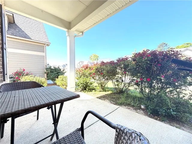 This inviting patio area features ample space for outdoor relaxation and enjoyment.