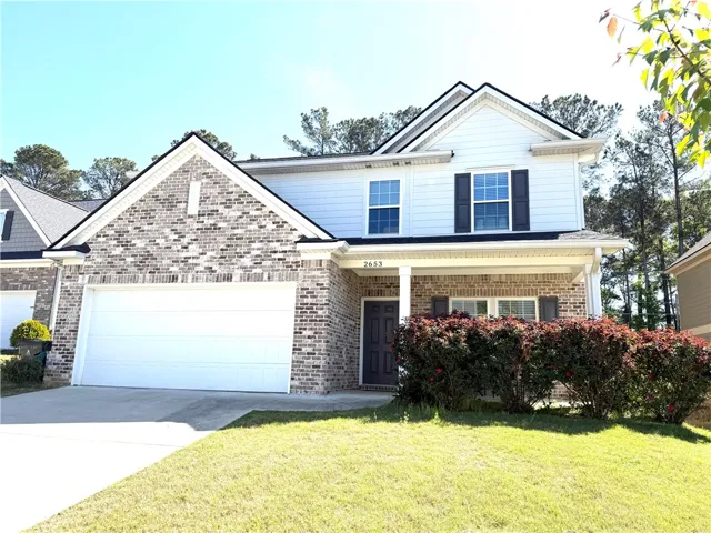 This charming residence features a well-maintained exterior and inviting curb appeal.