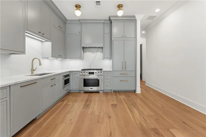 This modern kitchen offers sleek cabinetry, ample counter space, and integrated appliances for contemporary living.