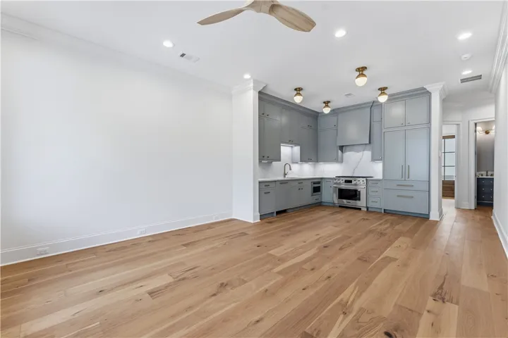 This living space flows seamlessly into a well-appointed kitchen, ideal for entertaining.