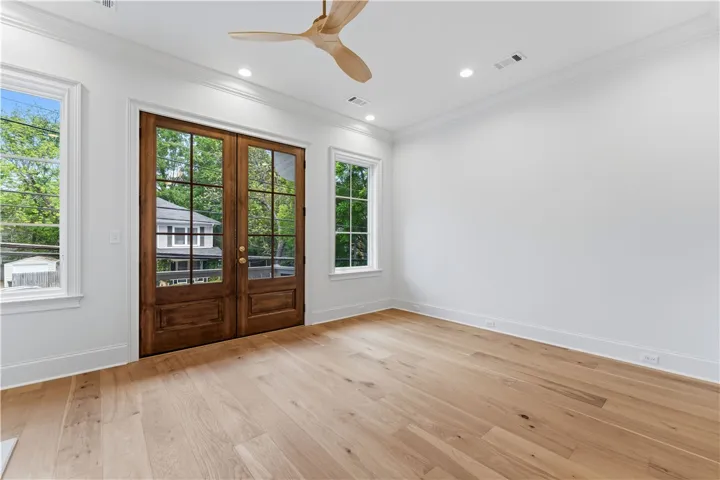This bright room features beautiful hardwood floors and large windows, perfect for natural light.