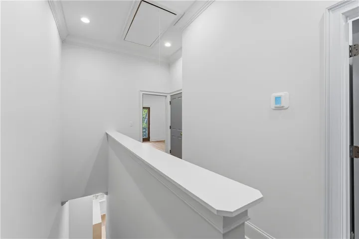 This bright hallway connects spaces with clean lines and architectural details.