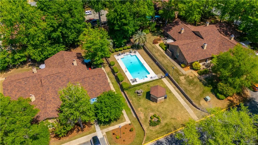 An aerial view captures the inviting community pool nestled among residential properties.