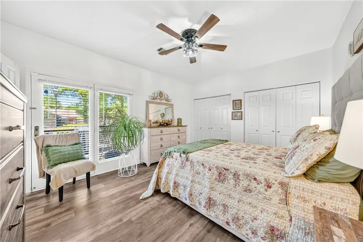 This spacious bedroom offers ample natural light and generous closet space, perfect for comfortable living.