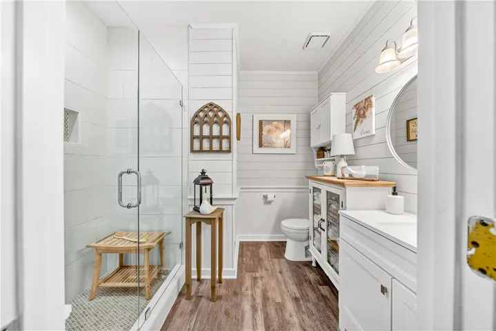 This bathroom features a contemporary shower and modern vanity with clean lines.