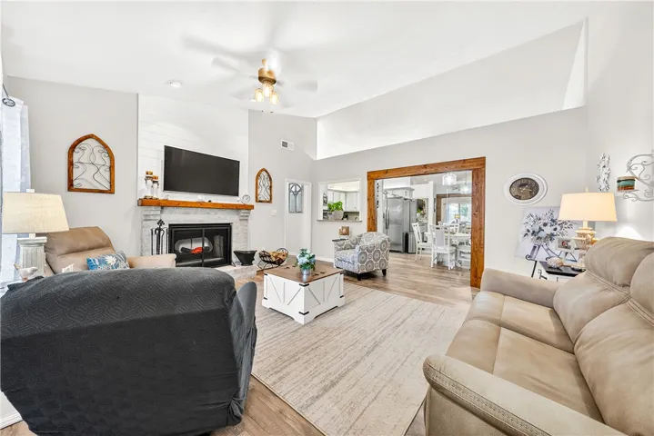Bright and open living space with a charming fireplace, perfect for gatherings.