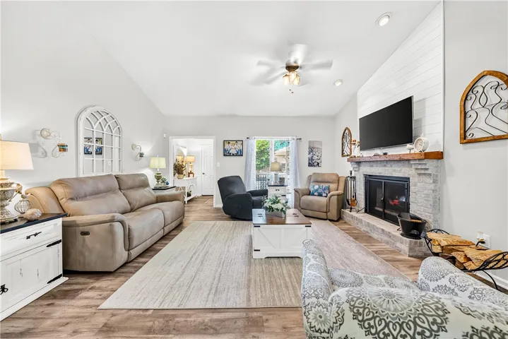 This inviting living area boasts an elegant fireplace and bright, spacious design.