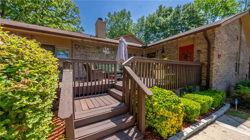 This charming home features a lovely deck, perfect for outdoor enjoyment and relaxation.