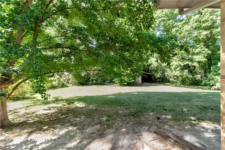 This spacious yard offers ample room for outdoor activities and future enhancements.