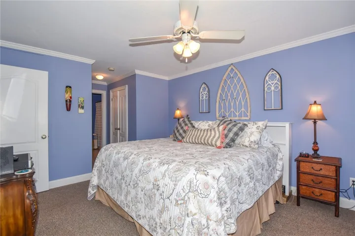 This inviting bedroom features ample space and soft lighting, creating a comfortable and private retreat.