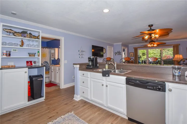 This spacious kitchen offers ample counter space, modern appliances, and seamless flow into adjacent areas.