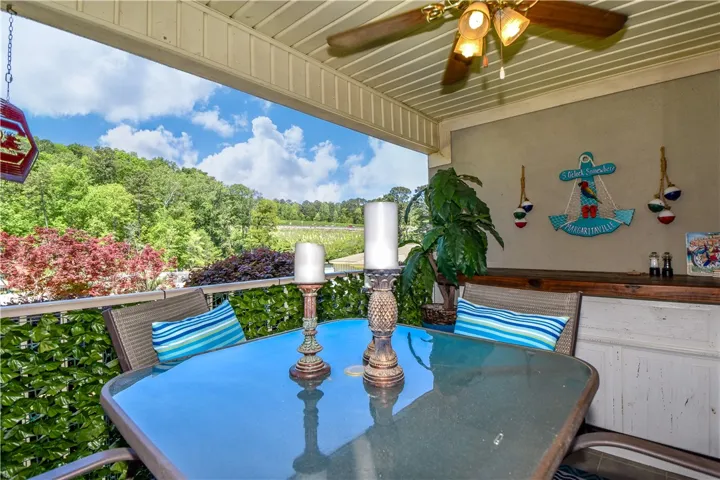 This inviting porch offers serene views, perfect for relaxation and enjoying the natural surroundings.