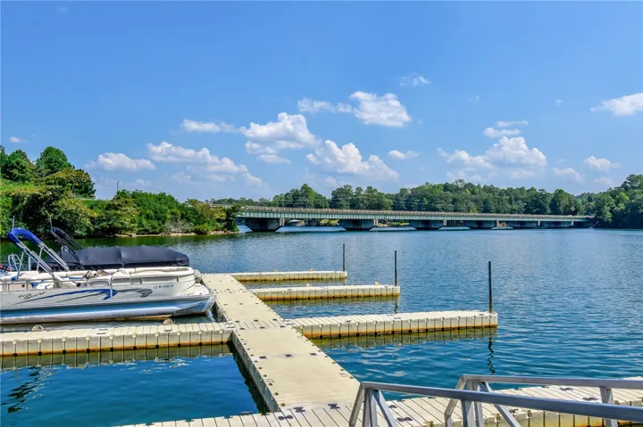 This serene waterfront property offers direct lake access and scenic views of the bridge.