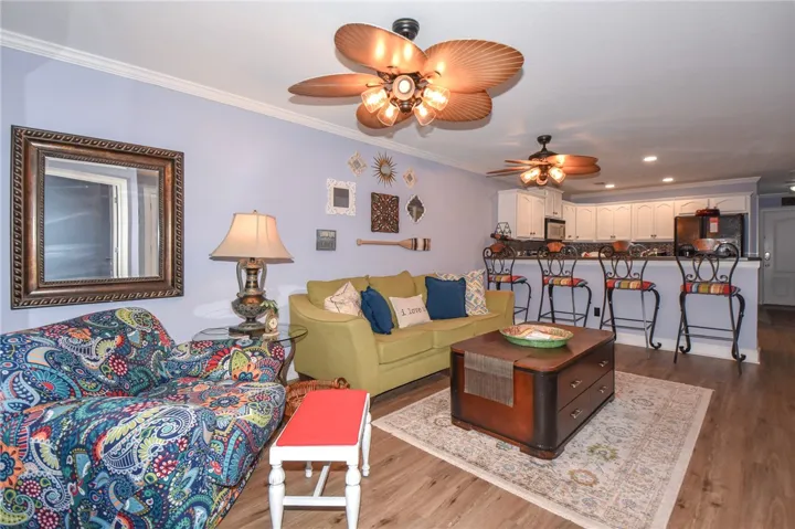 This inviting living area boasts an open floorplan with durable flooring.