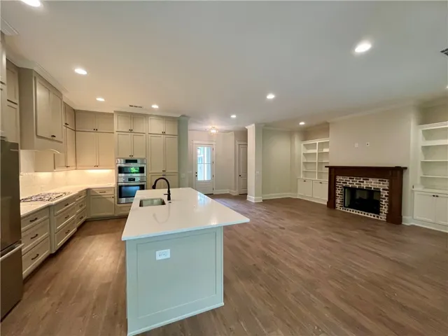 This inviting space features an open-concept layout, connecting the kitchen to the living area.
