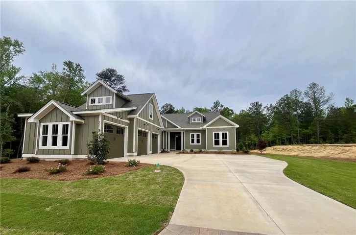 This newly constructed Pearl's Quail offers a tranquil setting with ample green space.