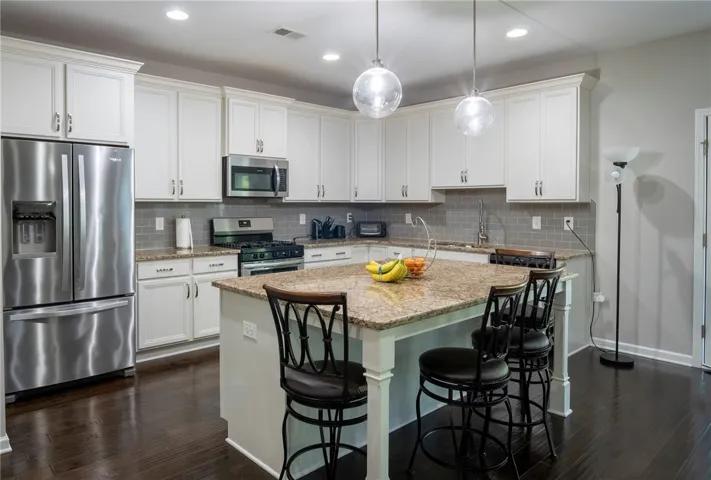 This inviting kitchen combines comfort and functionality for modern living.