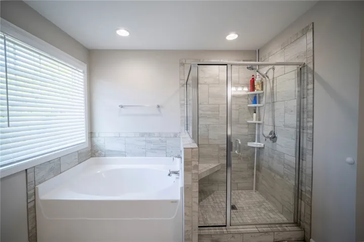 Relax in the deep soaking tub or rejuvenate in the tiled walk-in shower.