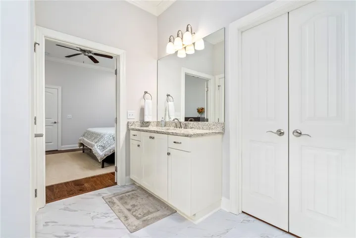 This primary bathroom features a double vanity and sleek modern finishes, offering a tranquil retreat.