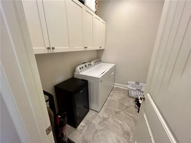 This dedicated laundry space offers practical convenience for daily chores.