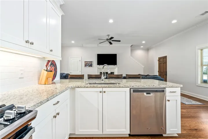 This bright kitchen features ample counter space, modern appliances, and seamless open-concept living.