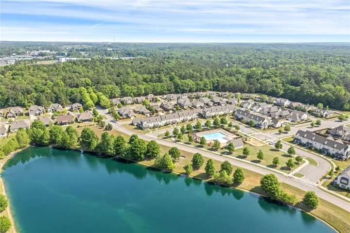 This tranquil community features a serene lake, a sparkling pool, and abundant green spaces.