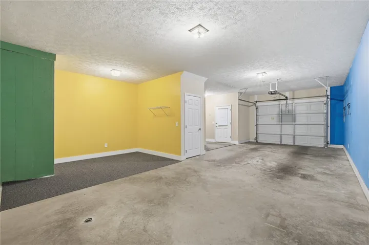 This spacious garage offers versatile space to park 2 vehicles, stacked. And additional recreational space for a workshop, gym, etc.