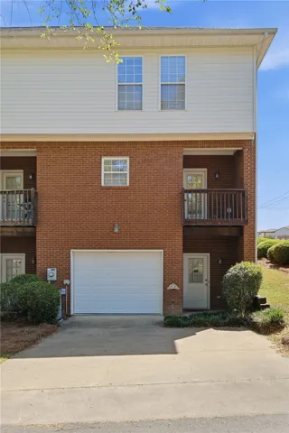 This multi-level residence features a private garage with additional driveway parking.