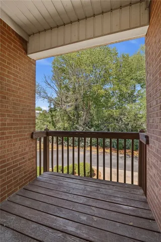 This outdoor balcony provides a private space with charming views.
