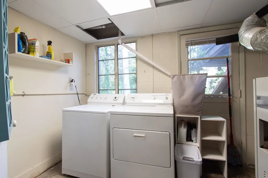 This functional laundry area features essential appliances and ample natural light for daily chores.