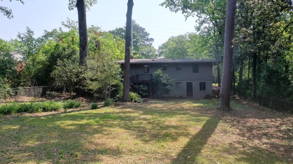 This residence offers a tranquil setting with ample green space.