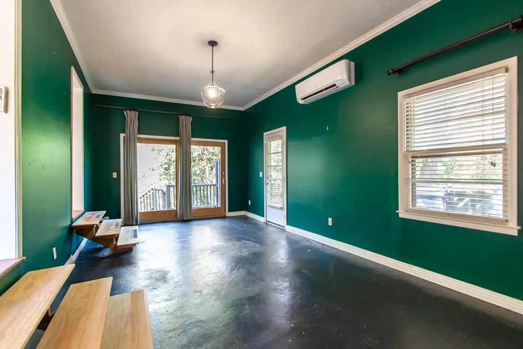 This versatile space features a private deck, offering an ideal setting for various activities.