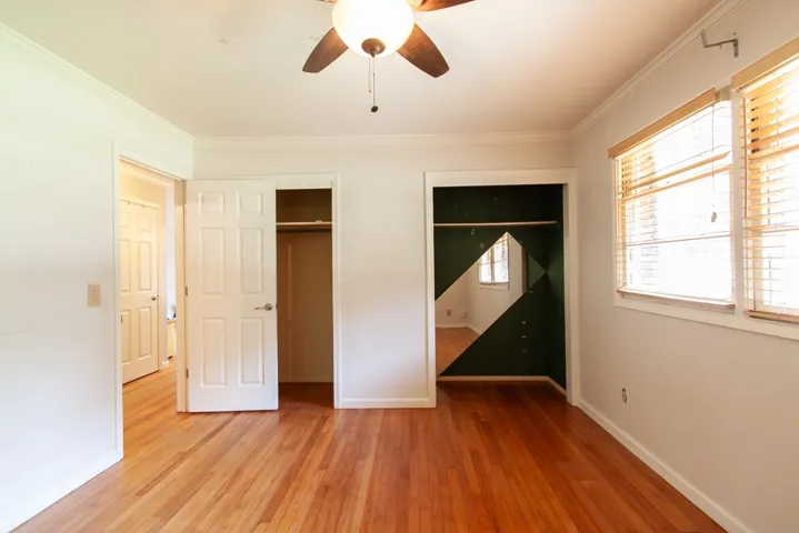 This bright room features beautiful hardwood floors and ample natural light, perfect for any use.