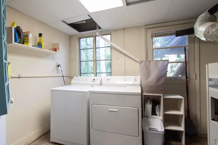 This functional laundry area features essential appliances and ample natural light for daily chores.