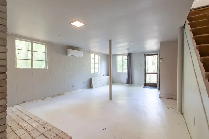This spacious, unfinished basement offers endless possibilities for customization and expansion.