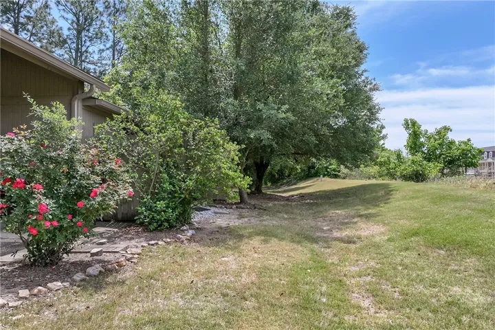 This spacious yard offers ample room for outdoor activities and gardening.