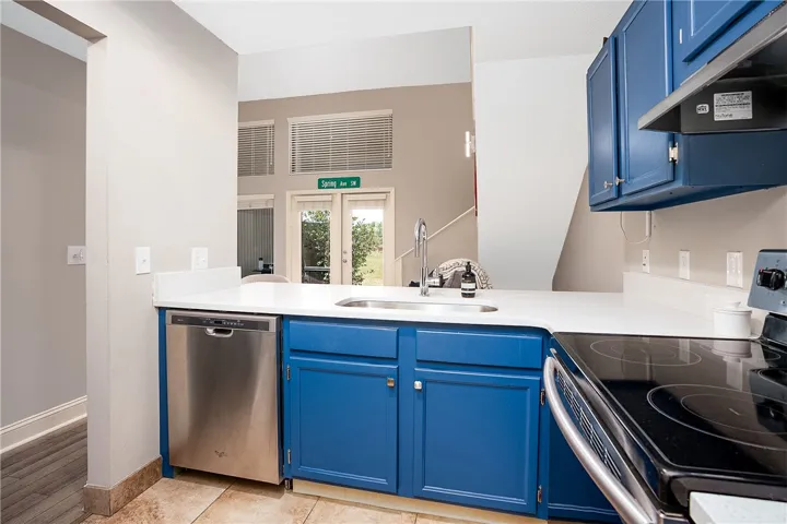 This bright kitchen features sleek countertops and modern appliances, perfect for everyday living.