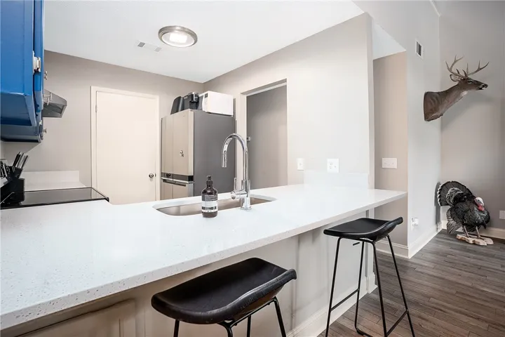 This modern kitchen features sleek countertops and appliances, perfect for everyday living.
