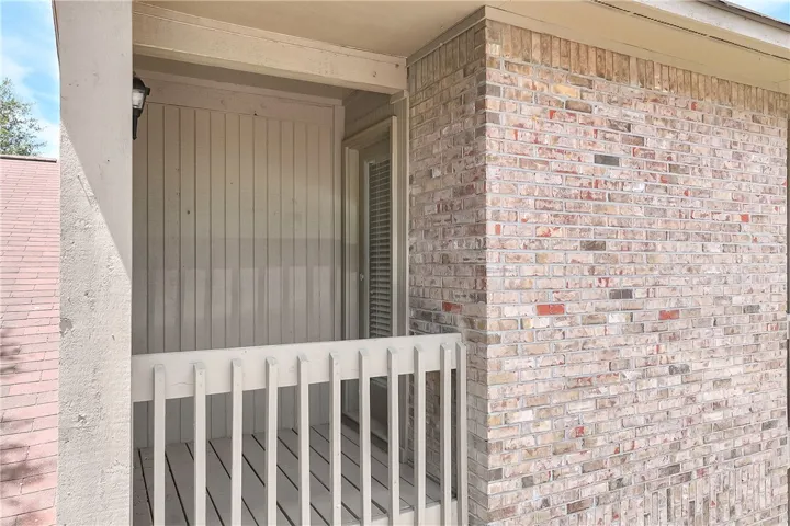 This cozy balcony offers a private outdoor retreat, perfect for enjoying quiet moments.