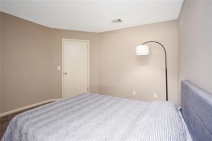 This inviting bedroom provides a comfortable and tranquil retreat for relaxation.