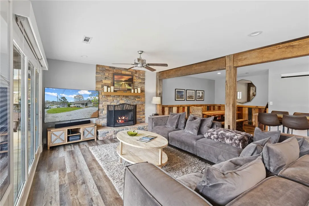 This inviting living space features a cozy fireplace, setting a comfortable and welcoming ambiance.