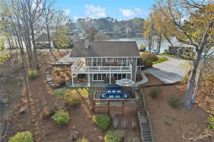 This lakeside residence features expansive decks overlooking tranquil waters.