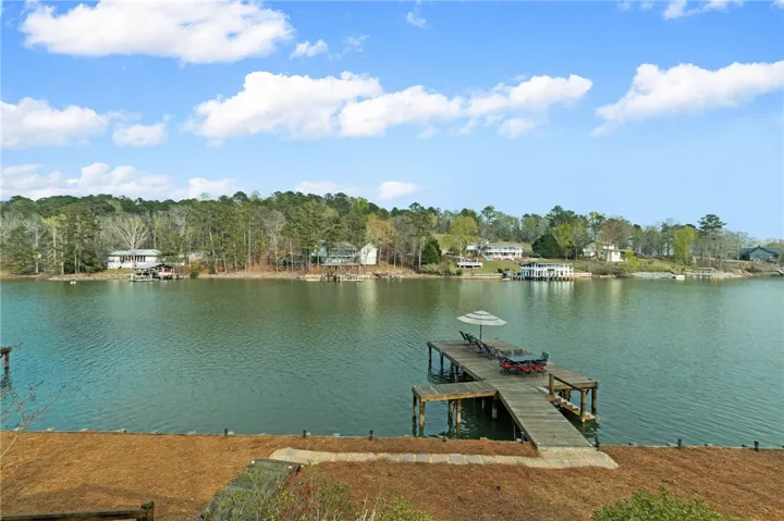 This lakeside retreat features a private dock, offering direct access to serene waters and outdoor enjoyment.