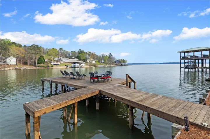 This tranquil waterfront retreat offers a spacious private dock, perfect for leisurely lakeside living.