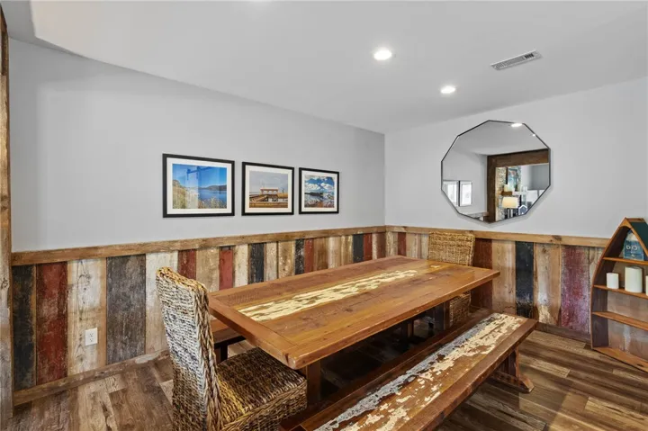 This dining area features reclaimed wood accents and warm lighting, perfect for intimate gatherings.