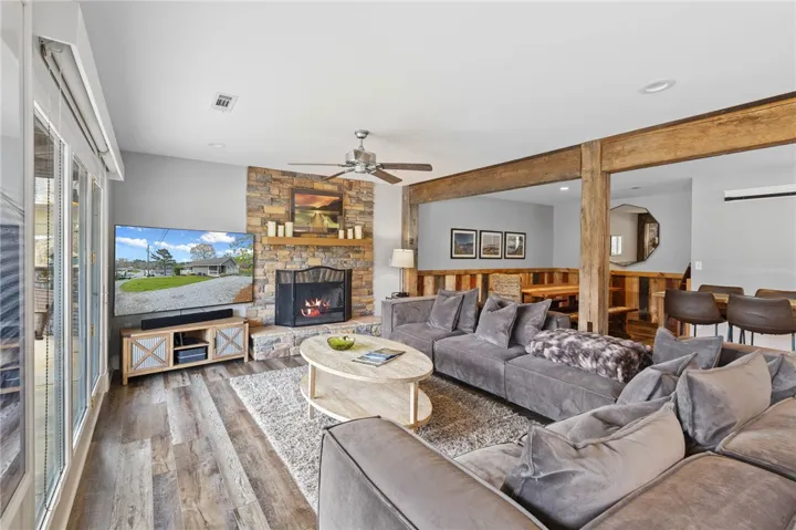 This inviting living space features a cozy fireplace, setting a comfortable and welcoming ambiance.