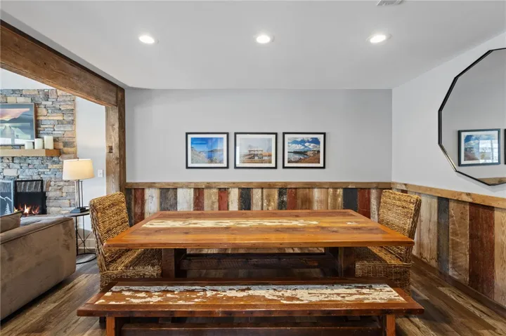 This inviting dining area features rustic wood accents, creating a warm and casual atmosphere.