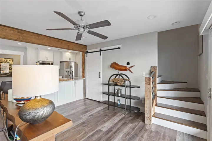 This inviting space seamlessly blends a well-appointed kitchen with an open living area.