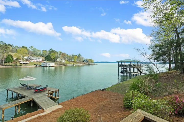 This serene waterfront property offers expansive lake views and private dock access.